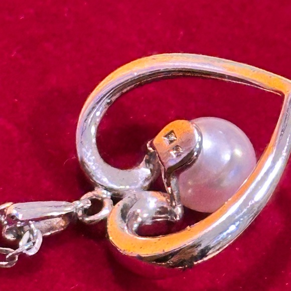 Mikimoto Silver Heart Necklace with Pearl
925 silver made. - Picture 7 of 12